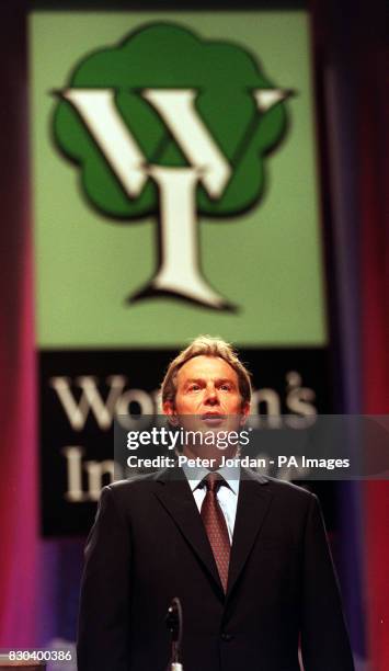 Prime Minister Tony Blair sings "Jerusalem" before he gives a speech at the Women's Institute annual conference in Wembley, London. The speech was...