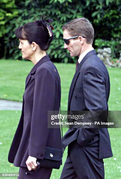 Jockey Ray Cochrane and his wife arrives at the funeral service of pilot Patrick Mackey held at St Joseph's Catholic Church in Newbury, Berks. Mr....