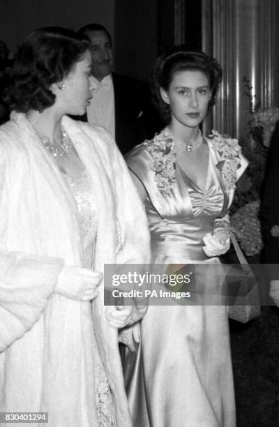 Princess Margaret, right, and Princess Elizabeth attending the world premiere of Sir Laurence Olivier's film version of Hamlet, at the Odeon cinema,...