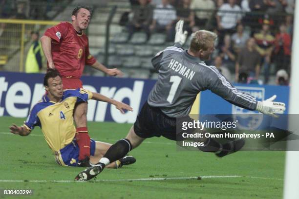 Belgium's Bart Goor scores the first goal of the Euro 2000 in Brussels against Sweden during the opening football match of the Euro 2000...