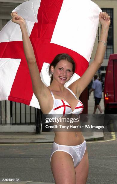 Gossard girl Kate Groombridge cheers the England soccer squad on ahead of their next Euro 2000 game against Germany by wearing a custom made St...