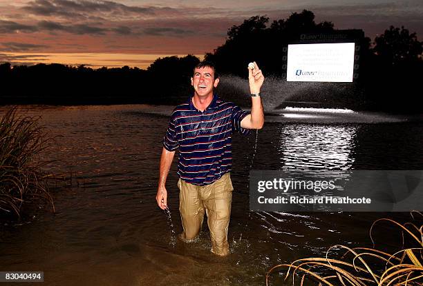 Gonzalo Fernandez-Castano of Spain celebrates in the lake around 18 green after beating Lee Westwood in a play-off during the final round of The...