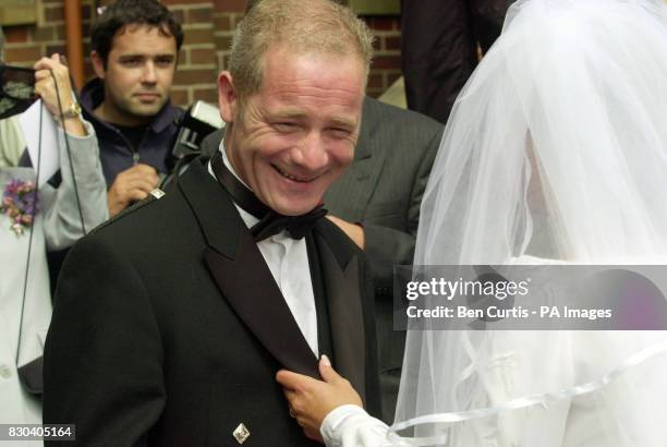 Scottish actor Peter Mullan talks to bride Gail Healy at her wedding to Scottish Socialist MSP Tommy Sheridan at the Our Lady of Lourdes Church in...