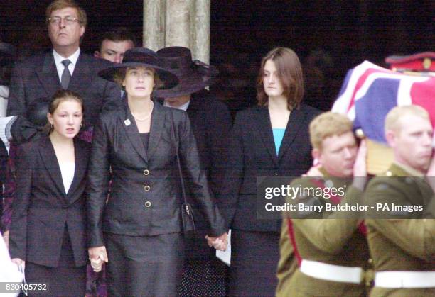 The coffin of Brigadier Stephen Saunders leaves Salisbury Cathedral followed by his widow Heather and daughters Catherine, 13 and Nicola, 15. The...