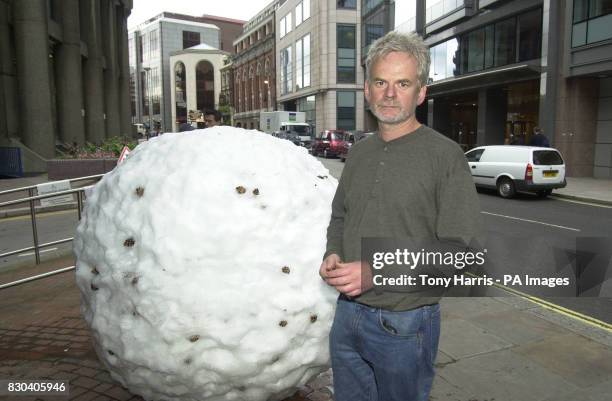 British sculptor Andy Goldsworthy stands in a London street next to a snowball which is forming part of an unusual art exhibition. The thirteen one...