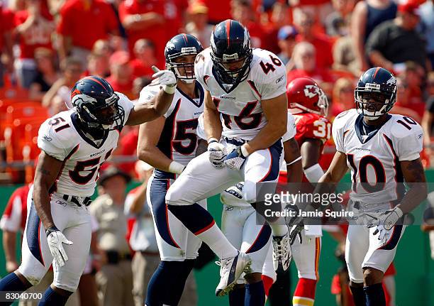 Spencer Larsen of the Denver Broncos celebrates with teammates after making a hit during the game against the Kansas City Chiefs on September 28,...