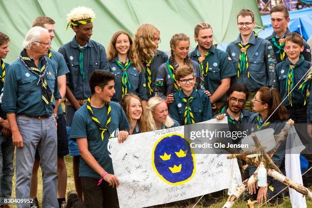 Swedish King Carl Gustav meets scouts from Norra Jaerva who have made a poster to their King with the royal Swedish symbol and the scouts name during...