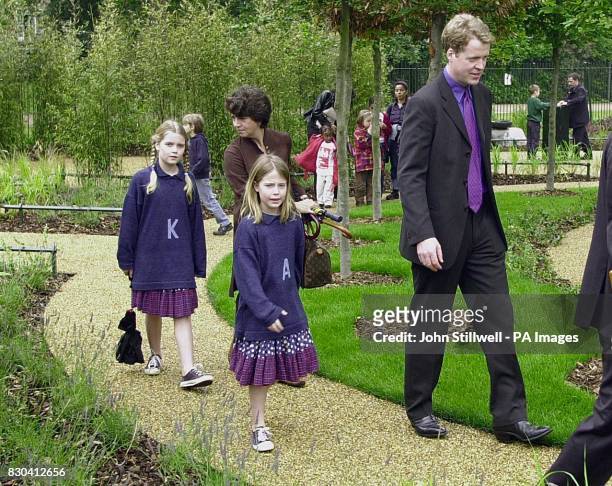 Earl Spencer with two of his children Kitty and Amelia, at the opening of the Diana, Princess of Wales memorial garden, in Hyde park.