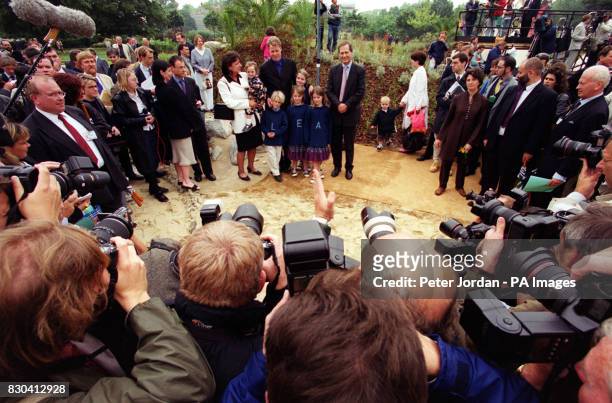 Rosa Monckton holds her daughter, Domenica alongside Earl Spencer and his children Louis, Eliza, Kitty and Amelia, at the opening in London of the...