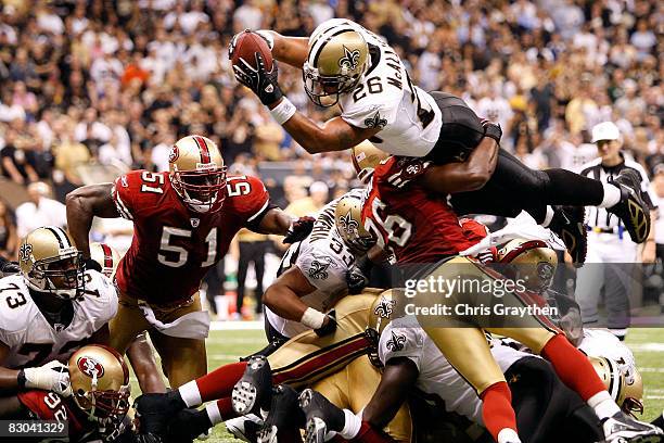 Deuce McAllister of the New Orleans Saints scores a touchdown over Mark Roman of the San Francisco 49ers on September 28 2008 at the Superdome in New...