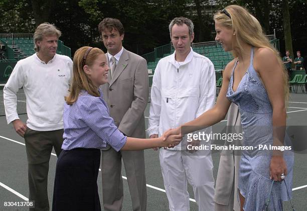 Princess Beatrice greets tennis player Anna Kournikova on Buckingham Palace tennis court before the start of the Duke of York's NSPCC Challenge...