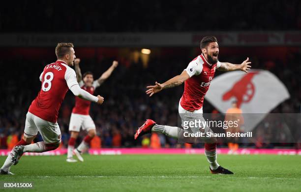Olivier Giroud of Arsenal celebrates after scoring his team's fourth goal during the Premier League match between Arsenal and Leicester City at the...