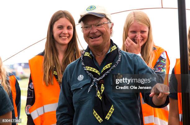 Swedish King Carl Gustav talks to scouts during his visit to the scouts jamboree on August 11, 2017 in Kristianstad, Sweden. The King took a long...