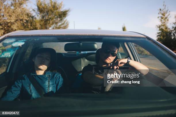 young couple have rest on the roadside