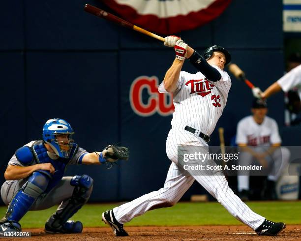 Justin Morneau of the Minnesota Twins strikes out in the seventh inning in a game against the Kansas City Royals at the Metrodome on September 28,...