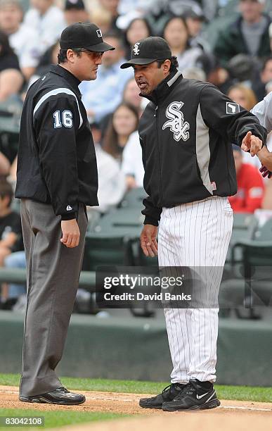 Ozzie Guillen manager of the Chicago White Sox argues a call at first base with Mike DiMuro during the 4th inning of a game against the Cleveland...