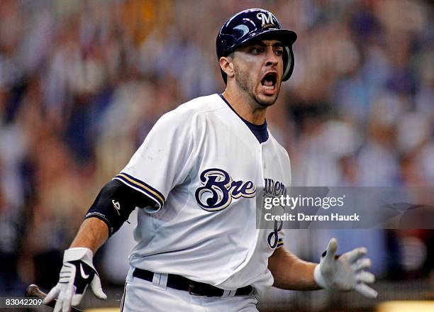 Ryan Braun of the Milwaukee Brewers celebrates his game winning two run home run against the Chicago Cubs in the eighth inning at Miller Park on...