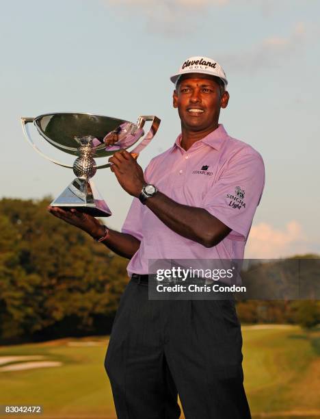 Vijay Singh of Fiji poses with the FedExCup trophy after the final round of THE TOUR Championship presented by Coca-Cola, at East Lake Golf Club on...