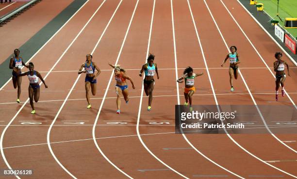 Dafne Schippers of the Netherlands, Marie-Josee Ta Lou of the Ivory Coast and Shaunae Miller-Uibo of the Bahamas cross the finish line in the Women's...