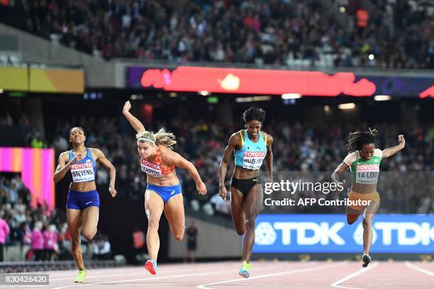 Netherlands' Dafne Schippers wins the final ahead of Ivory Coast's Marie-Josée Ta Lou and Bahamas's Shaunae Miller-Uibo of the women's 200m athletics...