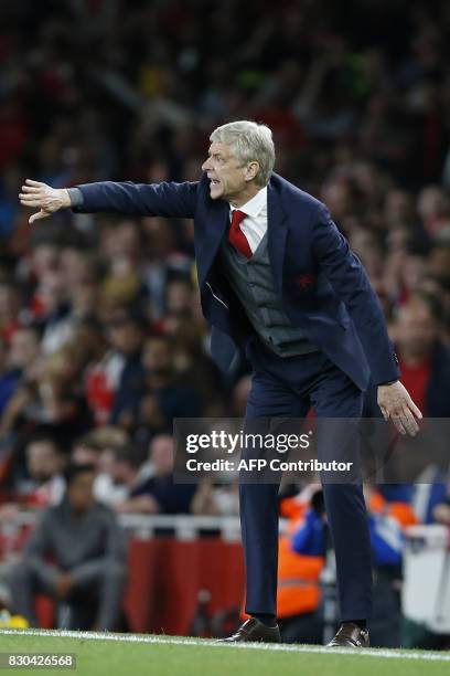 Arsenal's French manager Arsene Wenger gestures on the touchline during the English Premier League football match between Arsenal and Leicester City...