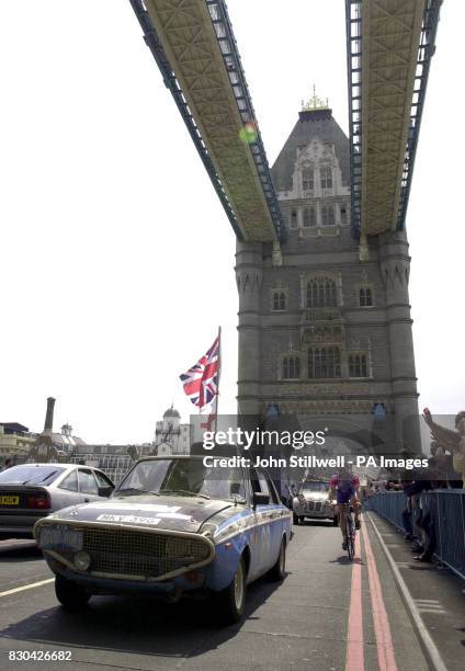 Husband and wife Freddie and Jan Giles from Wiltshire, in their 1967 Hillman Hunter, cross Tower bridge to win the classic section of the 'Around the...