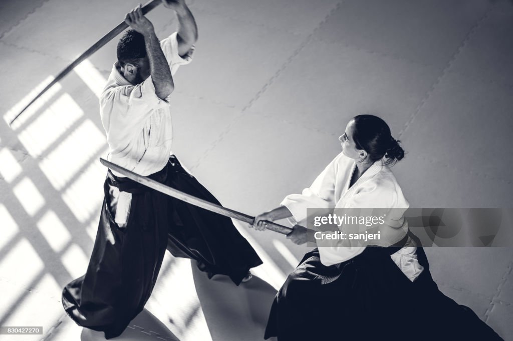 Two Aikido Fighters With Bokken Swords