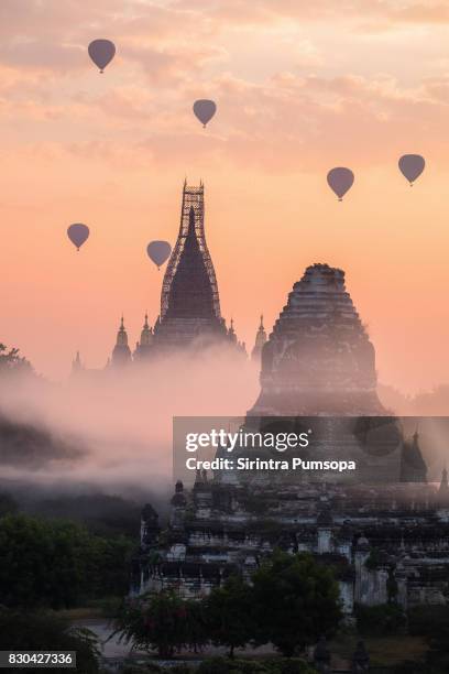 hot-air balloons flying over ananda temple in morning, bagan, myanmar - bagan temples damaged in myanmar earthquake stock pictures, royalty-free photos & images