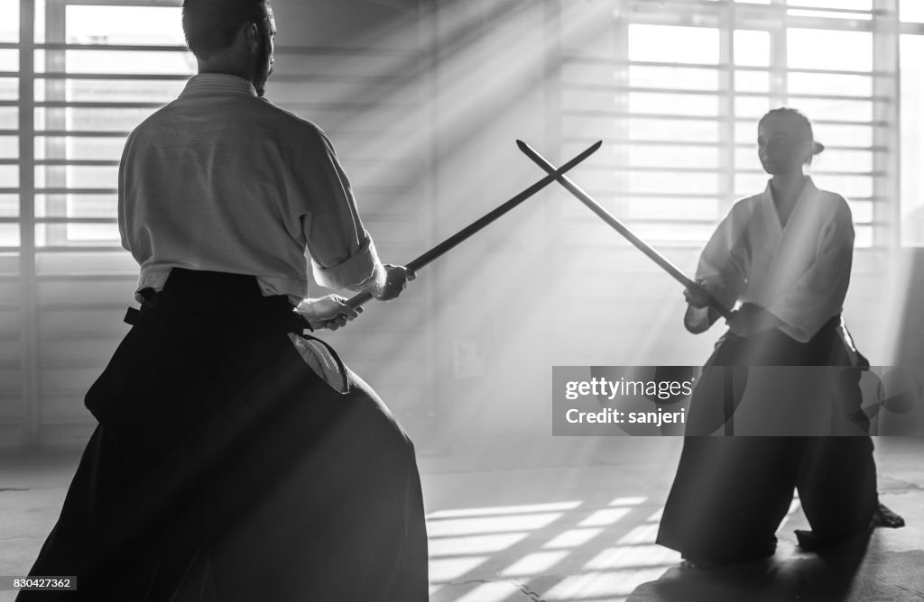 Two Aikido Fighters With Bokken Swords