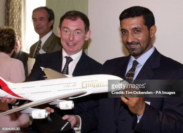 Emirates chairman, Sheik Ahmed bin Saeed Al Maktoum with Noel Forgeard, Chairman of Airbus, and a model of the Airbus Industrie's new A3XX superjumbo...