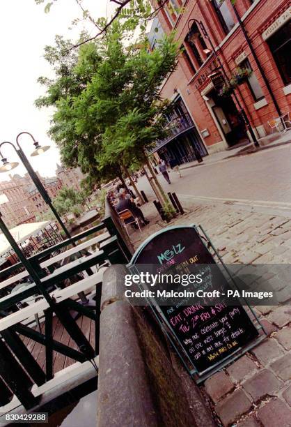 Sign advertising the delights of the Metz cafe-bar in Canal Street, Manchester, a famous gay district of the city.