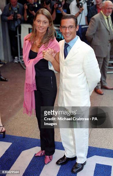 Champion jockey Frankie Dettori and his wife Catherine arriving for the European Premiere of the film "Gone In 60 Seconds" at the Odeon West End...