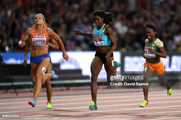 Dafne Schippers of the Netherlands, Marie-Josee Ta Lou of the Ivory Coast and Shaunae Miller-Uibo of the Bahamas cross the finish line in the Women's...