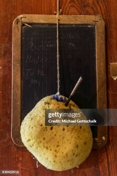 An old slateboard or blackboard with a sponge at Kanow mill Sagritz on August 09, 2017 in Golssen, Germany.