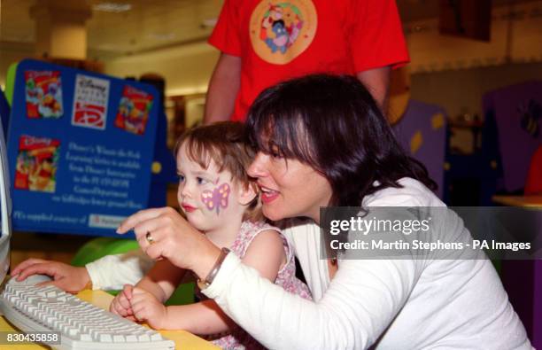 Comedienne and author Arabella Weir and her two year old daughter Isabella, appearing at the 'Winnie the Pooh Friendship Celebration', at Selfridges...