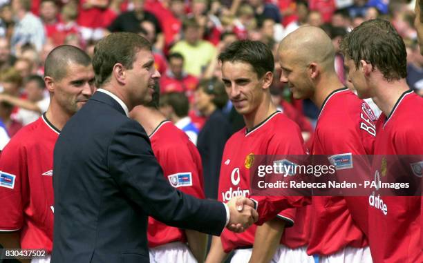 This picture can only be used within the context of an editorial feature.The Duke of York shakes hands with Manchester United's David Beckham as...