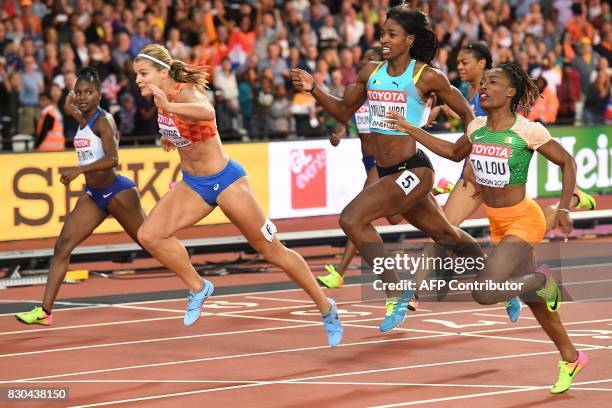 Netherlands' Dafne Schippers leads Ivory Coast's Marie-Josée Ta Lou and Bahamas's Shaunae Miller-Uibo to win the final of the women's 200m athletics...