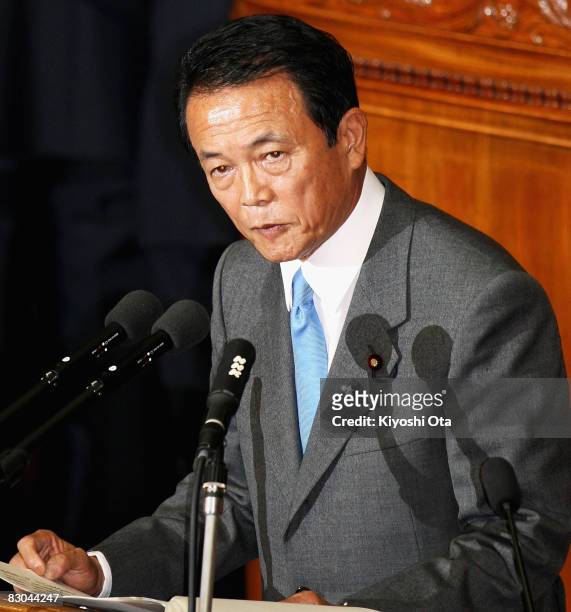 Japanese Prime Minister Taro Aso delivers a speech during the 170th Extraordinary Diet session at the Lower House on September 29, 2008 in Tokyo,...
