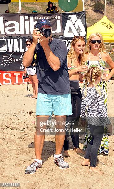 Kelsey takes pictures of the surfers with his daughter Spencer Grammer, wife Camille Grammer and youngest daughter Mason Olivia Grammer at the Oceana...