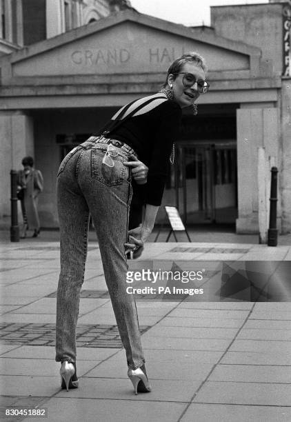 Actress Su Pollard shows off her cheeky side after winning the 1988 Rear of the Year award organised by the International Men's and Boys' Wear...