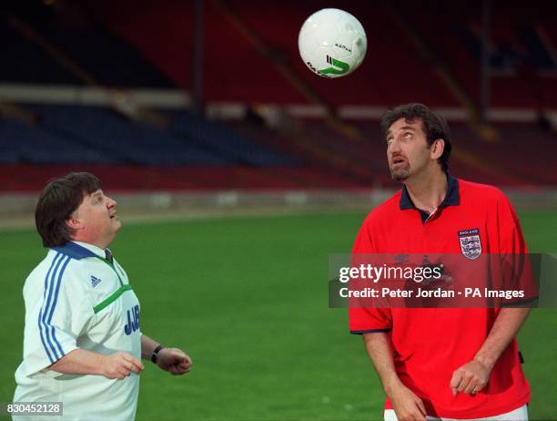 Cabinet Minister Ian McCartney and actor Jimmy Nail get their heads together at London's Wembley Stadium before a match between cabinet ministers and...