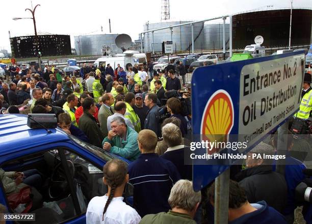 Protesters outside the Shell oil refinery in Stanlow, Cheshire, listening to a live radio broadcast of Prime Minister Tony Blair's speech on the fuel...