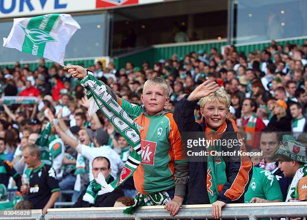 Young fans of Bremen are seen during the Bundesliga match between Werder Bremen and 1899 Hoffenheim at the Weser stadium on September 27, 2008 in...