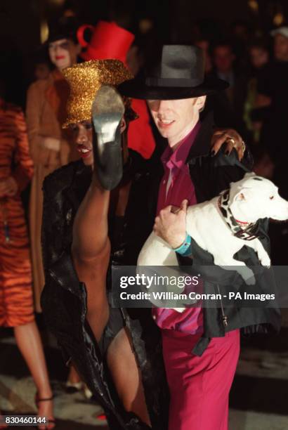 Suknger and model Grace Jones with hat designer Philip Treacy on Bond Street as part of London Fashion Week.