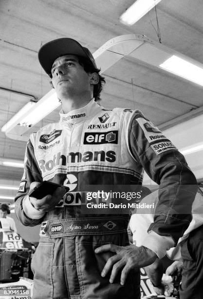 Brazilian Formula 1 race car driver Ayrton Senna watching a monitor during a qualification round of the San Marino Grand Prix on the Imola Circuit,...