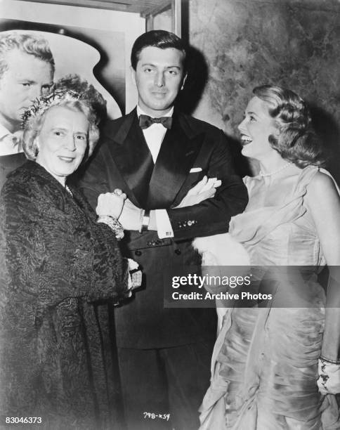 Actress Cobina Wright , French fashion designer Hubert de Givenchy and American actress Sara Shane pose together at the premiere of the film 'So Big'...