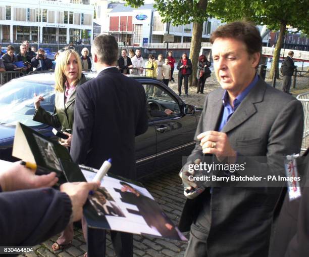 Former Beatle Paul McCartney with his friend Heather Mills leave the gallery, Arnolfini, in Bristol, after making last minute preparations for the...