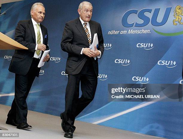 Bavarian Premier and CSU main candidate Guenther Beckstein and CSU Chairman Erwin Huber leave after a press conference after a meeting of the party...