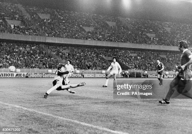 Liverpool's Alan Kennedy scores the only goal during the European Cup Final in Paris against Real Madrid, beating goalkeeper Agustin.