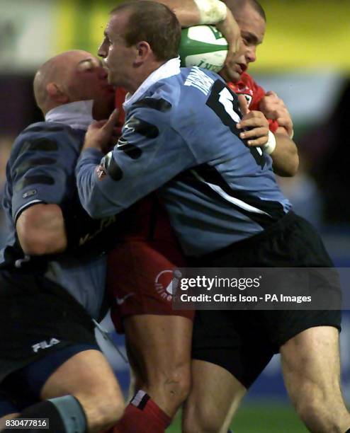 Cardiff RFC's Craig Quinnell and Gareth Thomas in action sandwiching Toulouse's Yannick Bru during their Heineken Cup match at the Cardiff Arms Park.